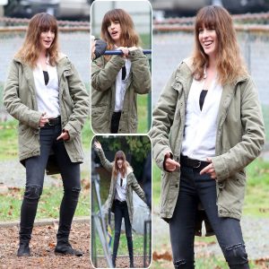 Anne Hathaway rocks a scruffy fringed hairpiece, appearing unrecognizable as she playfully messes around on the set of Colossal.