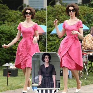 Gorgeous: Anne Hathaway cut a fashionable figure in a dazzling 1960s cocktail dress while filming in New Jersey.