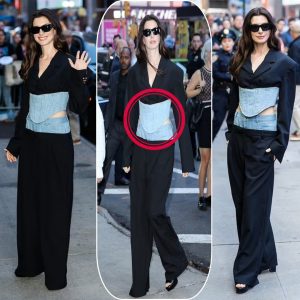 Anne Hathaway showcases her quirky style with a double denim ensemble featuring a peek at her toned midriff as she arrives at the Today show